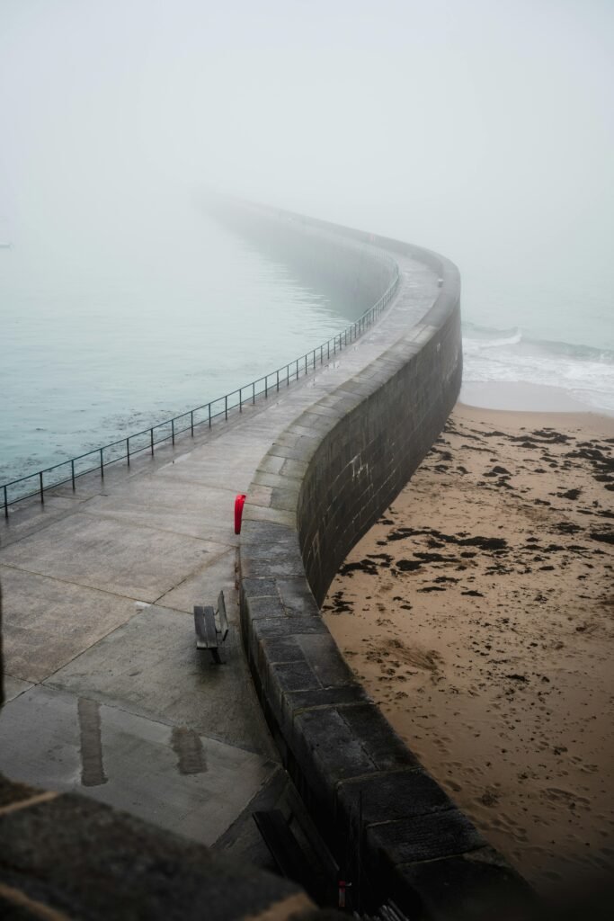 Atmospheric view of a misty breakwater in Saint-Malo, Bretagne, France.